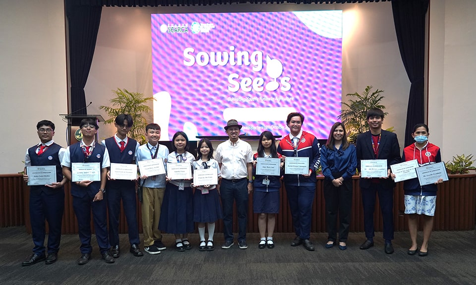 Eight grade school and high school student-inventors from Colegio de San Juan de Letran Calamba and their coaches pose with the SEARCA team led by Dr. Glenn Gregorio, SEARCA Center Director