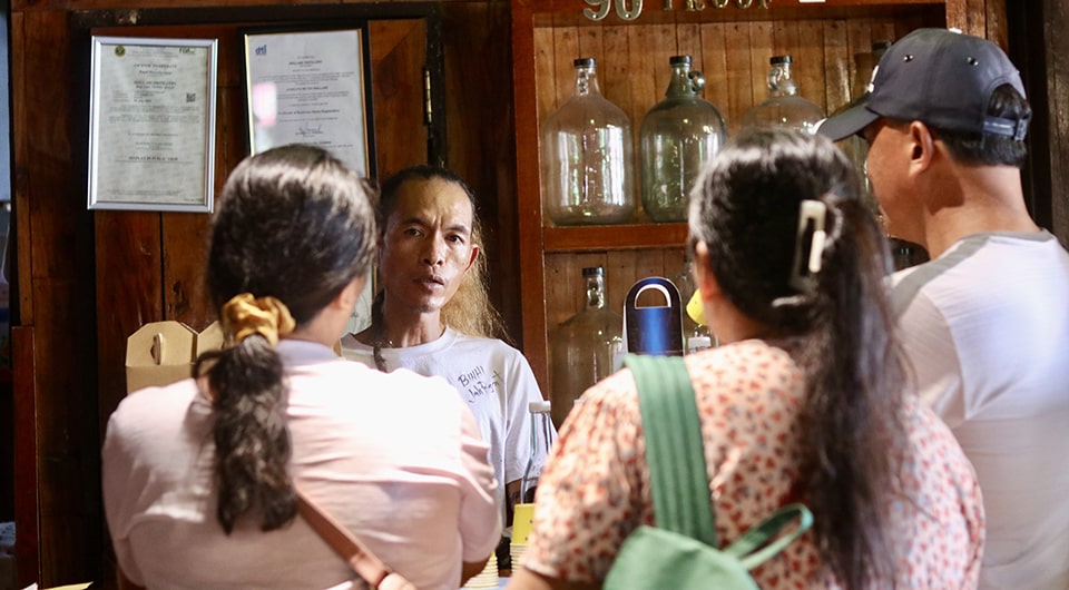 Participants during their short visit to the Mallari Distillery shop.