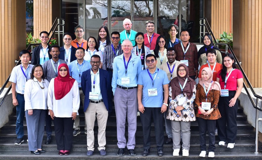 Participants and trainers of the Training on Quality Assurance for Livestock Greenhouse Gas Measurement pose in front of the SEARCA headquarters.