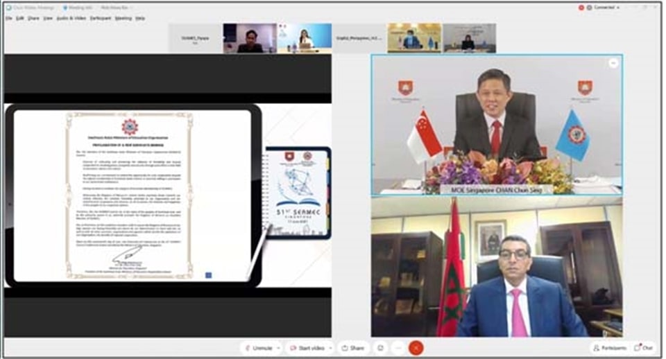 H. E. Chan Chun Sing (top), Minister for Education of Singapore and newly elected SEAMEO Council President, presented the proclamation of a new Associate Member to H.E. Abdelilah EI Housni, Ambassador of the Kingdom of Morocco to Thailand, Cambodia, Lao PDR, and Myanmar, during the virtual 51st SEAMEO Council Conference held on 17 June 2021. Photo courtesy of SEAMES