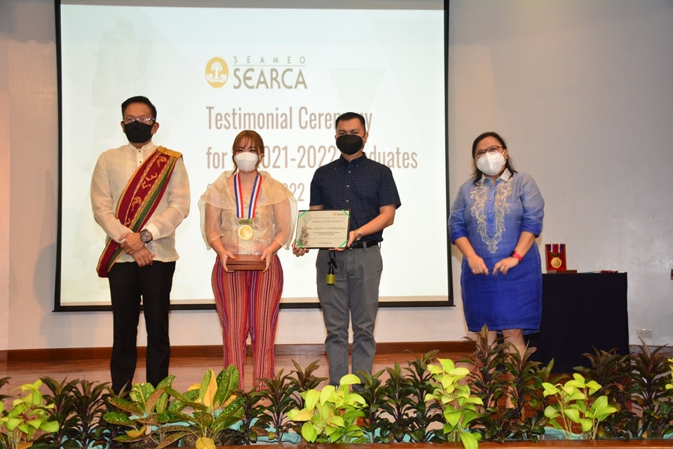 left to right: Prof. Joselito G. Florendo, Deputy Director for Administration of SEARCA, together with the awardee, Ms. Ma. Genesis T. Catindig-Reyes and family, and Dr. Maria Cristeta N. Cuaresma, Senior Program Head of Education and Collective Learning Department.