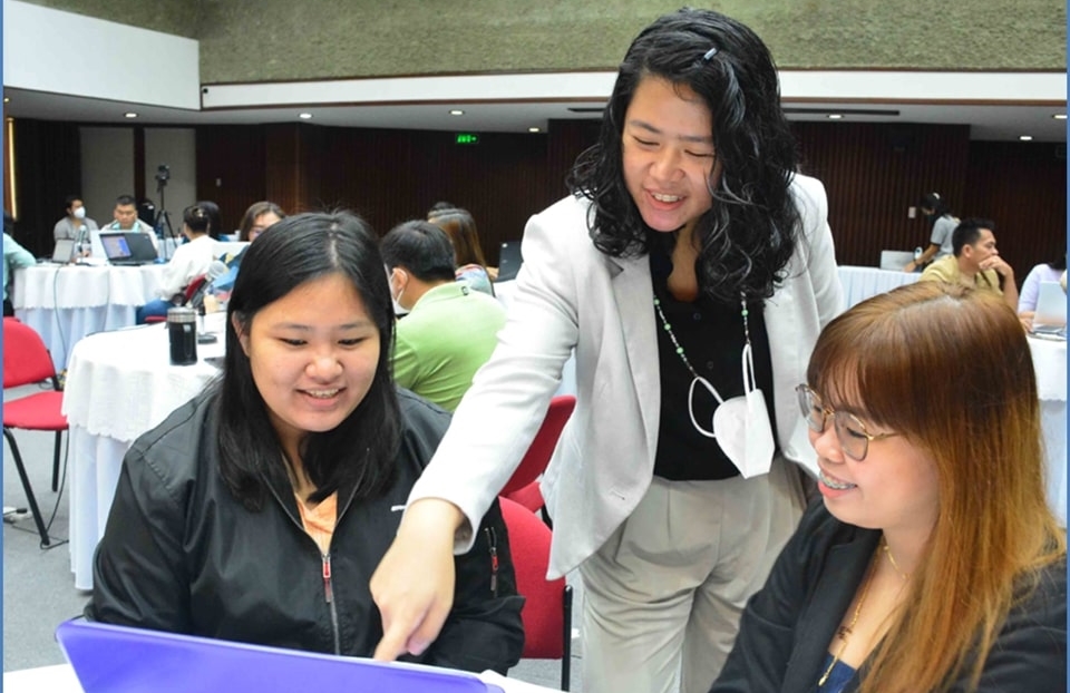 Ms. Jamina Siso, Instructor, Kalinga State University, in a mentoring session with Asst. Prof. Angelyn Mananghaya (standing) and Ms. Lysette Aguila, Resource Persons from the Institute of Statistics, College of Arts and Sciences, UPLB.