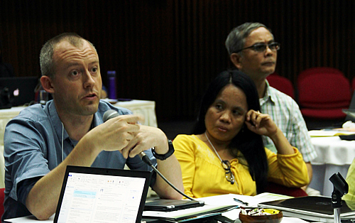 Dr. Kris Wyckhuys, cassava entomologist at CIAT, makes a point as Ms. Catherine C. de Luna and Dr. Vichien Kerdsuk, researchers at UPLB and Khon Kaen University, Thailand, look on.