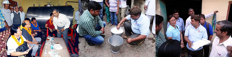 (L-R): At Balab Village in Rohtak District, PCC officials confer with village officials, and observe and discuss the milk collection and recording scheme that were established by the NDDB in the village.