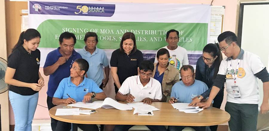 Seated (L-R): Mr. Victoriano Petina, Jr., President of RDPA; Mr. Rolly C. Mateo, Chairman, BSNMPC; and Mr. Romeo S. Doton, Chairman, PPMPC. | Standing (L-R): Ms. Sarah Quiñones, SEARCA Project Coordinator; Mr. Reynaldo D. Paneda; Science Research Analyst/AI Coordinator of PCC at DMMMSU; Mr. Ricardo C. Eblogan, Sr., Vice President, RDPA; Ms. Nancy Landicho, SEARCA Program Specialist; Dir. Gloria M. dela Cruz, PCC Center Director at DMMMSU; and Mr. Nicasio E. Olipas, Jr., Vice Chairman of PPMPC.