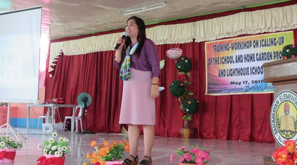 Ms. Soledad Villanueva, Principal of Bagumbayan Elementary School, presenting the framework of the School and Home Gardens Project. 