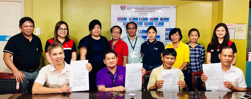 Board Members of CLB-CARES and ISAT-U together with PCC and SEARCA officials and staff posed for a photo showing the signed MOAs for the project Provision of Equipment and Materials to Calinog-Lambunao-Bingawan Caradairy Raisers Entrepreneur's and Iloilo Science and Technology University and Community Multi-Purpose Cooperative on 8 November 2018 at Western Visayas College of Science and Technology Multi-Purpose Cooperative Building in La Paz, Iloilo City.